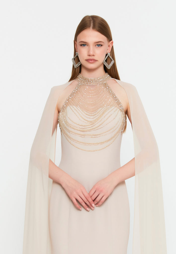 High-Neck Beaded Cape Gown – Cascading Jewel Drape, Sheer Flowing Sleeves & Sculpted Mermaid Silhouette