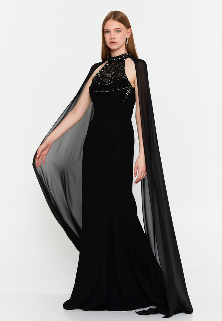 High-Neck Beaded Cape Gown – Cascading Jewel Drape, Sheer Flowing Sleeves & Sculpted Mermaid Silhouette