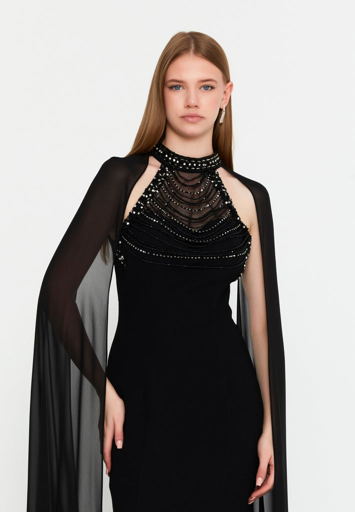 High-Neck Beaded Cape Gown – Cascading Jewel Drape, Sheer Flowing Sleeves & Sculpted Mermaid Silhouette
