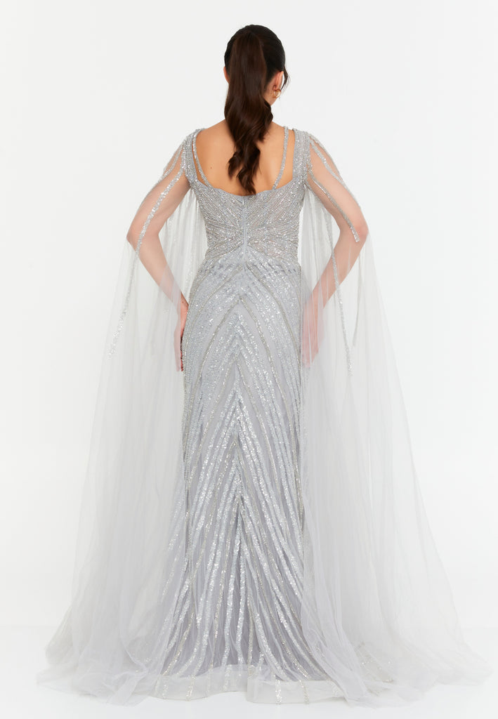 Celestial Beaded Cape-Sleeve Gown – Crisscross Neckline, Off-Shoulder Bodice, Front Slit & Flowing Tulle Trains