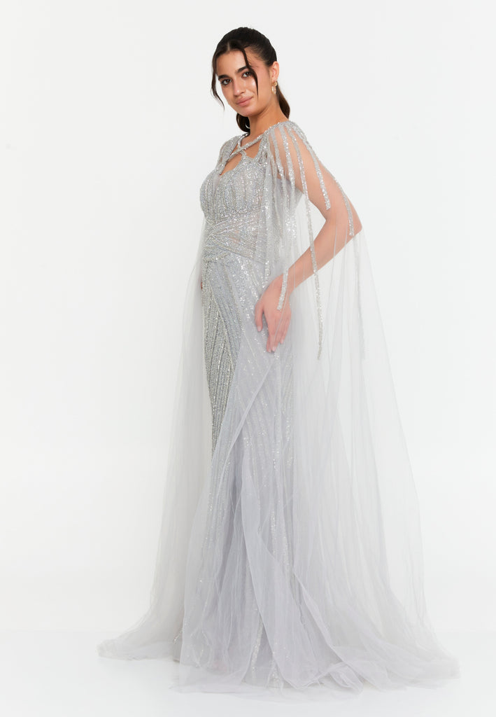 Celestial Beaded Cape-Sleeve Gown – Crisscross Neckline, Off-Shoulder Bodice, Front Slit & Flowing Tulle Trains