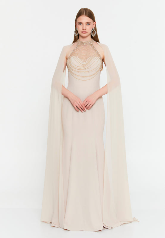 High-Neck Beaded Cape Gown – Cascading Jewel Drape, Sheer Flowing Sleeves & Sculpted Mermaid Silhouette